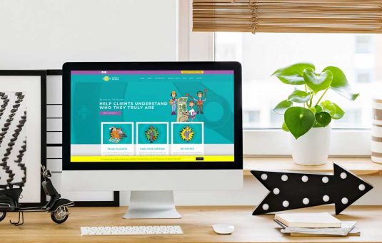 IGNITION-HOMEPAGE The Ignition! website homepage displayed on an iMac computer sat on a desk