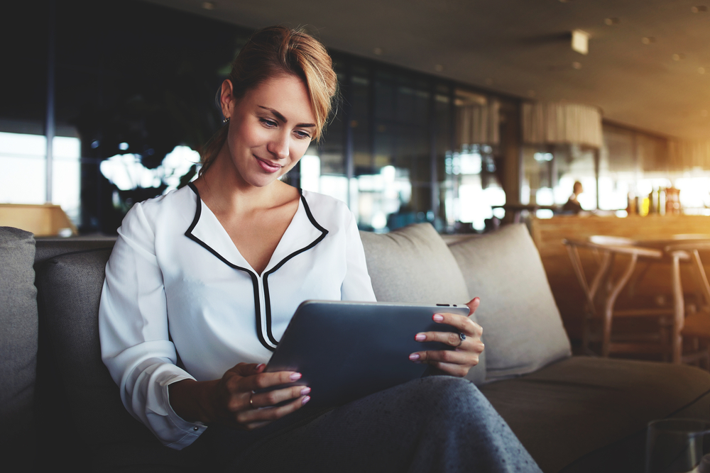 Woman reading a marketing presentation on an iPad