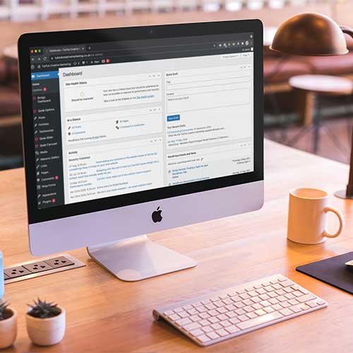 wordpress-website-dashboard A Wordpress website dashboard displayed on a Mac computer