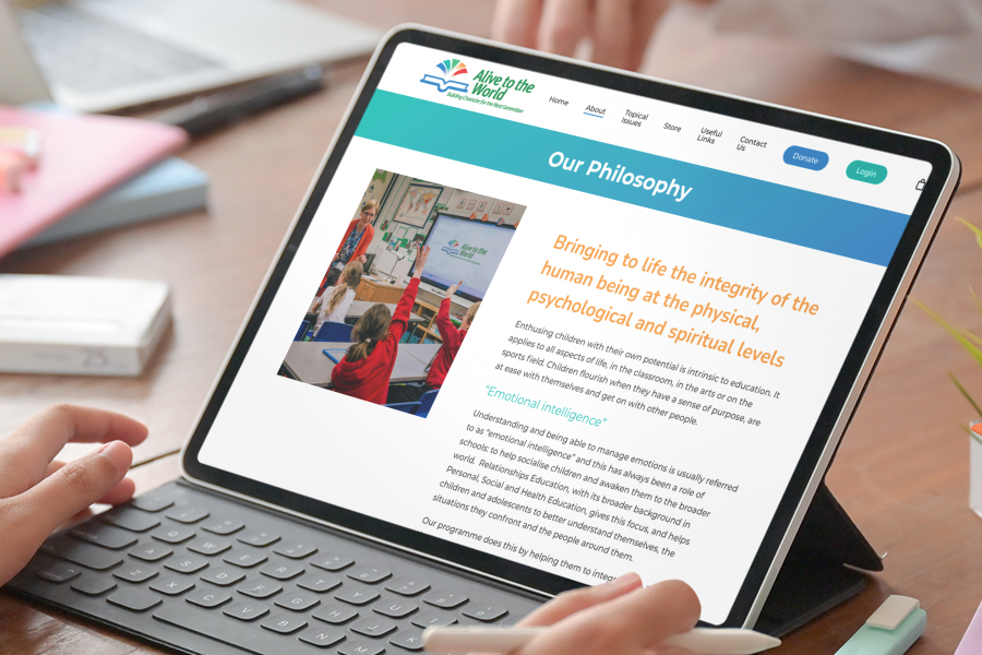 Philosophy iPad with keyboard showing Alive to the World, Philosophy page